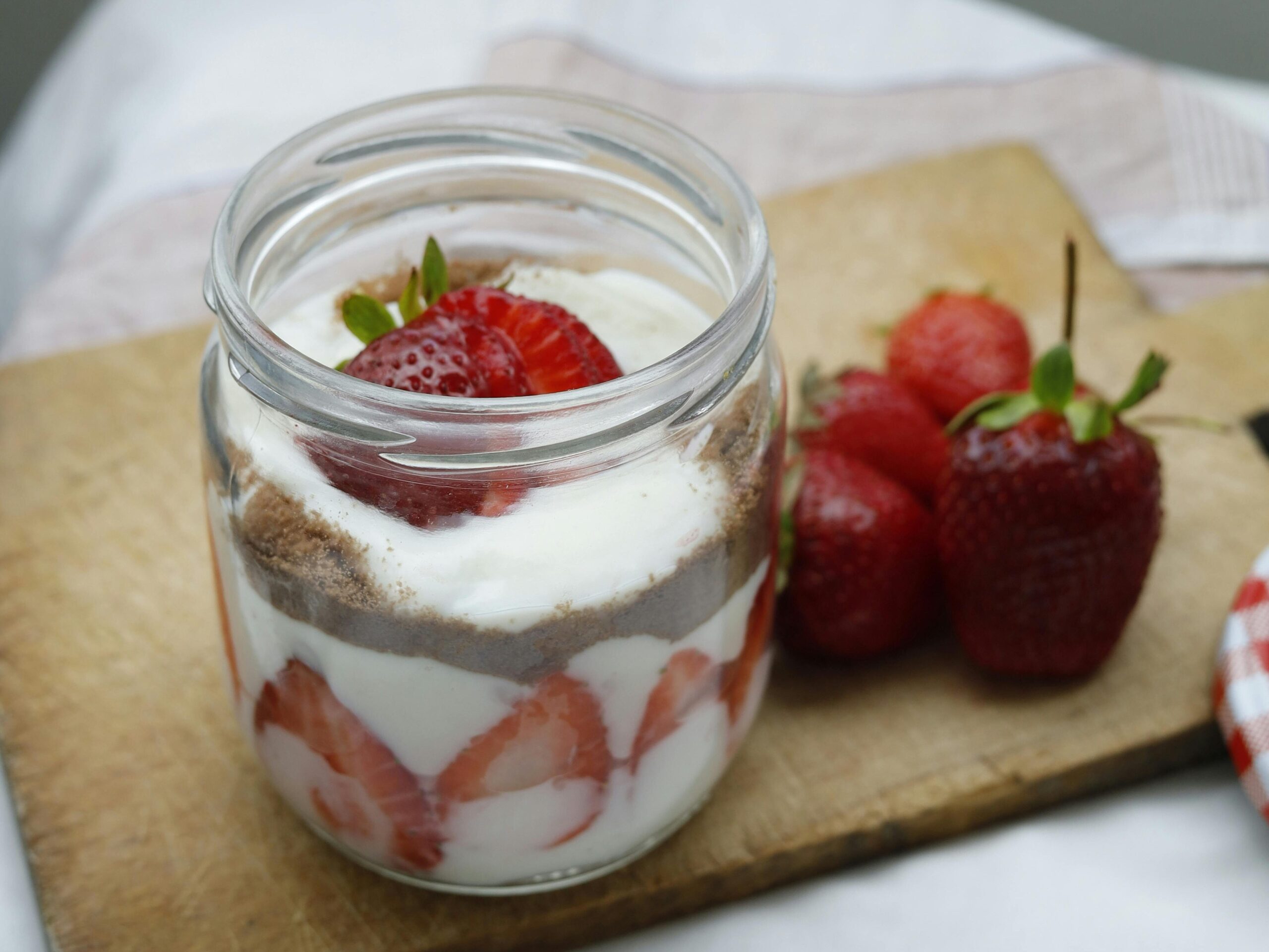 Mason jar yogurt parfait on a kitchen counter